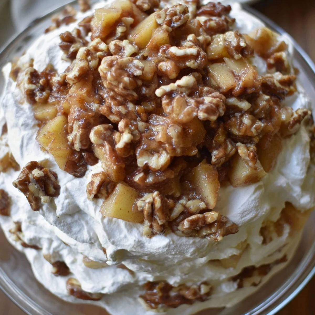 Creamy Spiced Apple Praline Whip Dip topped with crunchy pecan clusters and warm spices.  