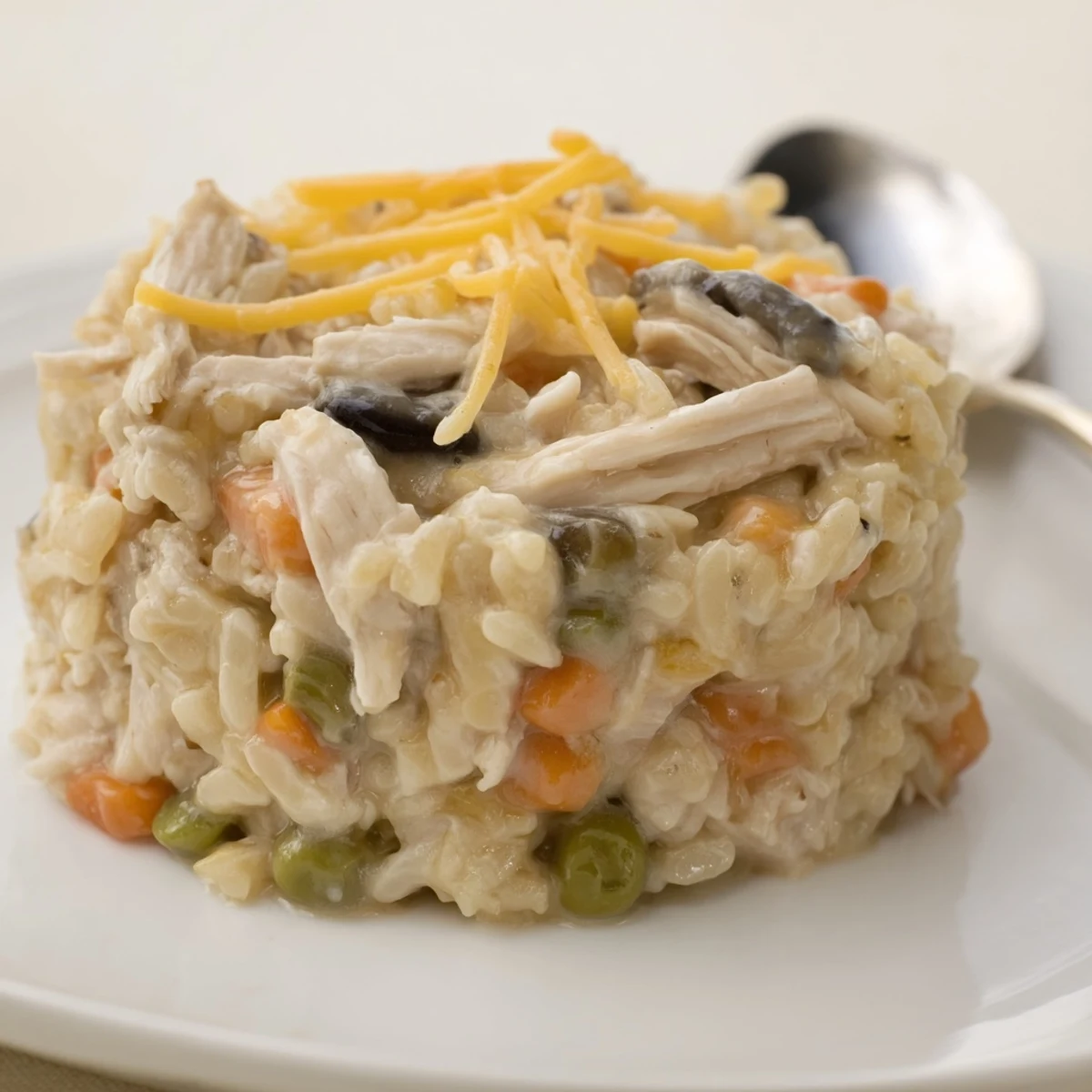 Hearty chicken and rice casserole with vibrant veggies, comforting for any meal.  