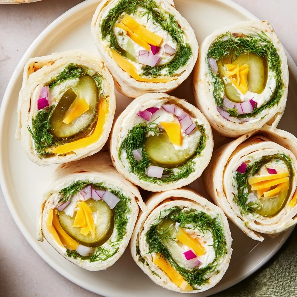 Delicious Pickle-in-a-Blanket snack, featuring tangy pickles and savory melted cheese.  