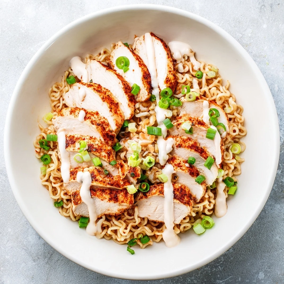 Enjoy a comforting bowl of Fiery Chicken Ramen, a vibrant mix of spicy broth and savory chicken, ready to eat.