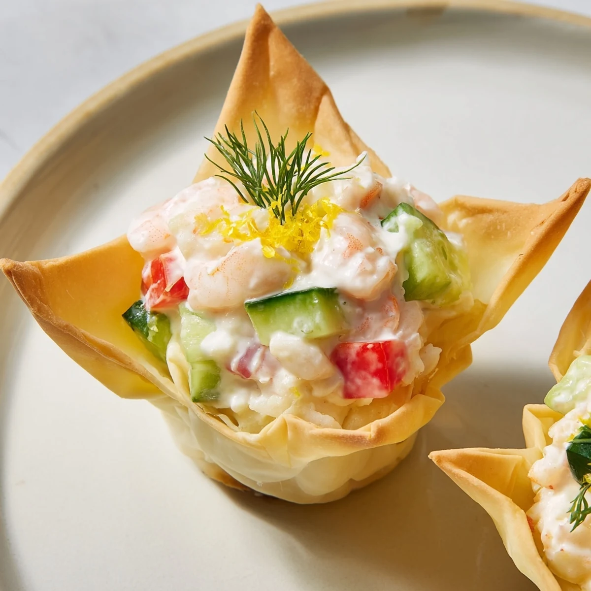 Creamy shrimp and vegetable filling spills over the delicate edges of Mini Star Cocktail Cups, a perfect bite.