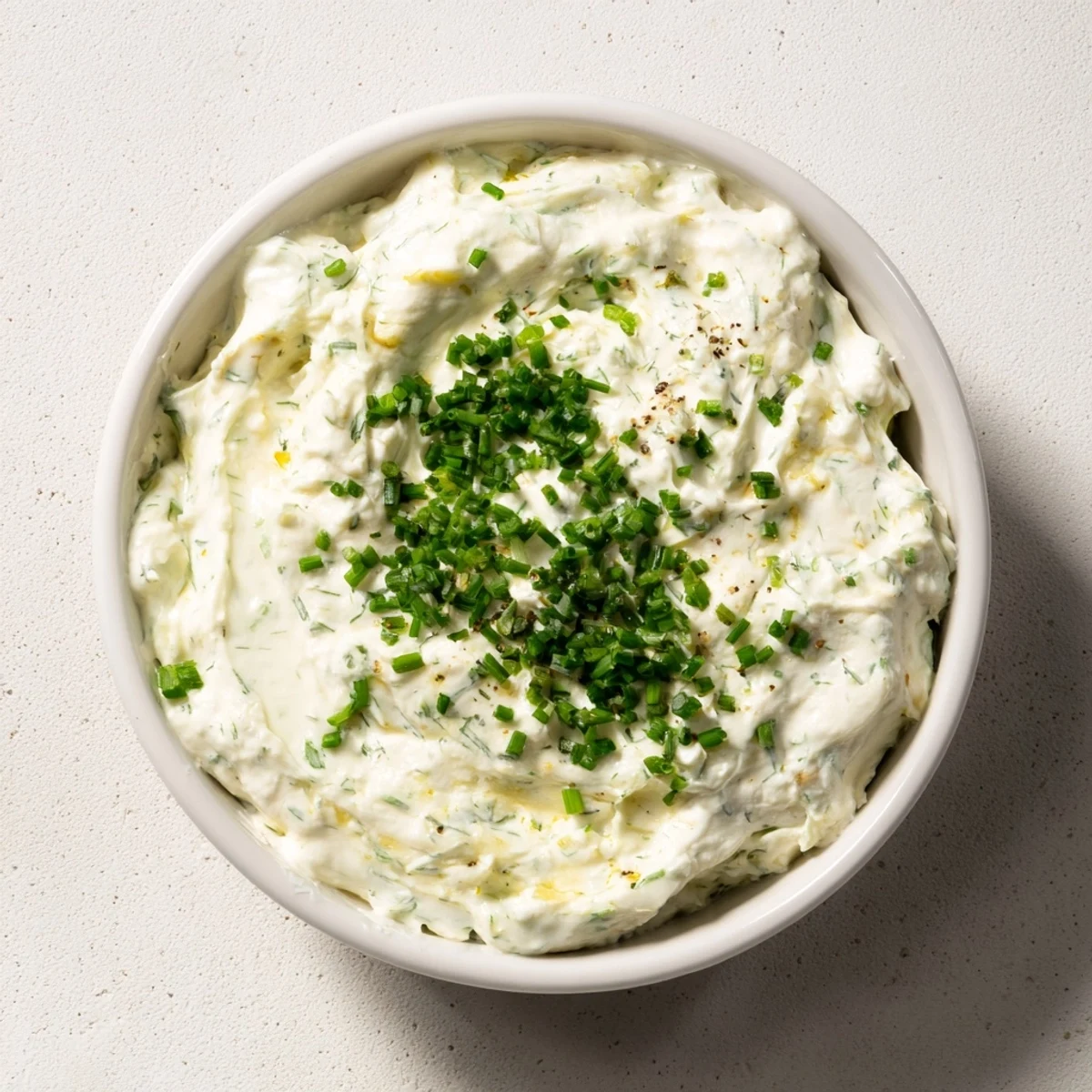 A vibrant veggie ranch dip, creamy and tangy, served with colorful fresh vegetable sticks.