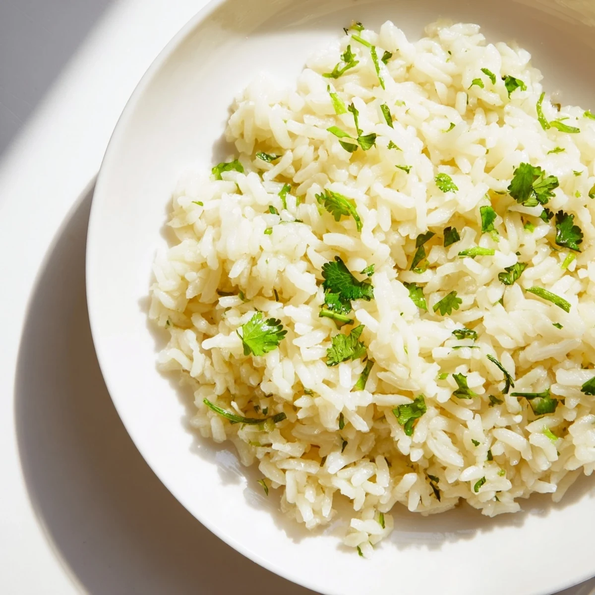 Fluffy Cilantro Lime Rice: a vibrant side dish, bright green with fresh cilantro and zesty lime.