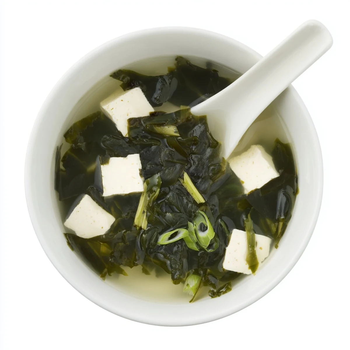 A hearty serving of Japanese wakame soup, featuring rehydrated seaweed and tofu floating in a savory broth.