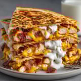 Mouthwatering Chicken Bacon Ranch Quesadillas, oozing with cheese, a perfect game-day appetizer.