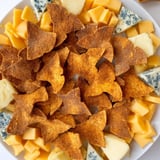 This festive Spooky Night Bat Halloween Board presents a delicious array of snacks perfect for a gathering.