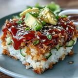 A delicious Crispy Rice Salad with Avocado and spicy tuna, ready to be enjoyed.