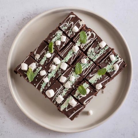 Crisp, rich, and shareable—this hot chocolate bomb bark features swirling white chocolate and fluffy marshmallows.