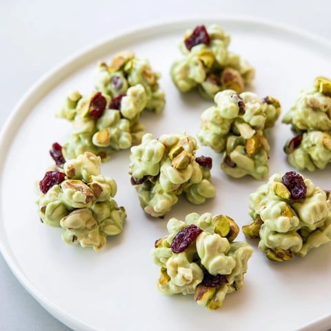 Matcha White Chocolate Cranberry Bark Clusters, a vibrant treat with delightful cranberry bursts, ready to serve.