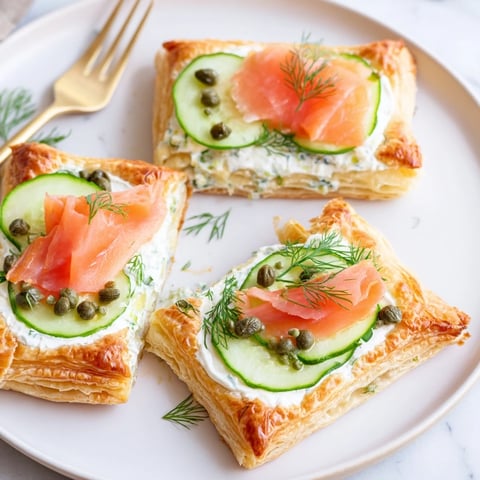Golden-baked Étoiles Filantes Assiette de Fin dAnnée stars showcase smoked salmon, fresh herbs, and creamy cream cheese.
