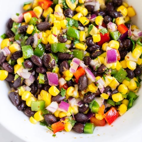Vibrant Cowboy Caviar Salad: a colorful medley of beans, corn, and peppers, ready to be served.