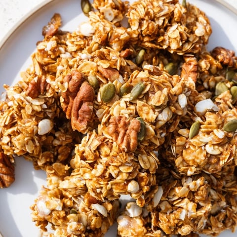 Golden brown, crunchy Granola Clusters, perfect for breakfast or a healthy snack, made with rolled oats.