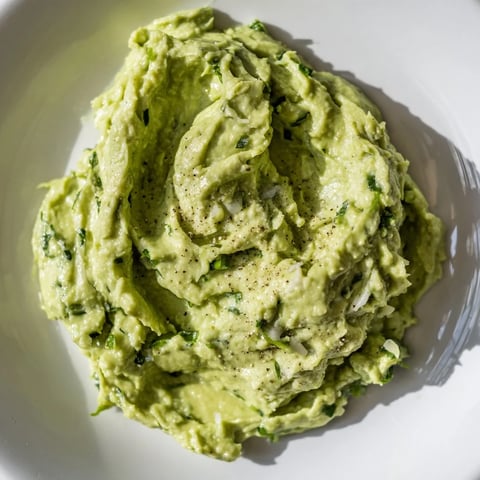 Bright green Avocado Lime Dip, chunky and refreshing, ready to be scooped with crispy tortilla chips.