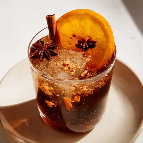 Refreshing Cinnamon-Spiced Chai Fizz, featuring warm spices and chilled citrus flavors.  