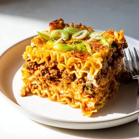 Mouthwatering Spicy Ramen Lasagna bursting with flavors and vibrant ingredients awaits you.  