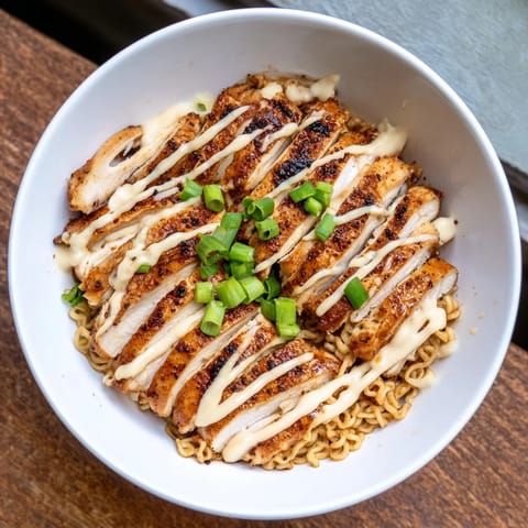 A close-up of flavorful Fiery Chicken Ramen, showcasing the rich broth and perfectly cooked ramen noodles.