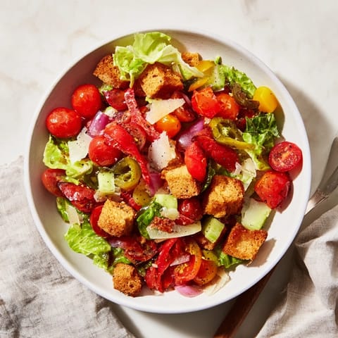 This La Scala Chopped Chickpea Salad features colorful chopped vegetables and creamy chickpeas, ready to eat.