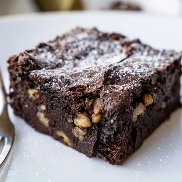 Fudgy zero-waste brownies made with nut-milk pulp, topped with dark chocolate chips.  