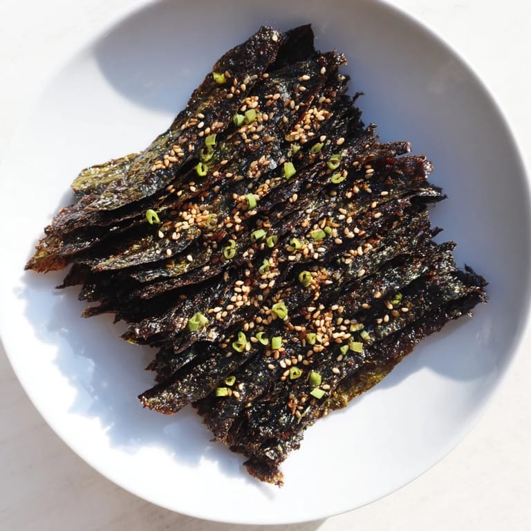 Stacked bite-sized Snacks de Vague Surf, sprinkled with sesame seeds for added flavor and texture.